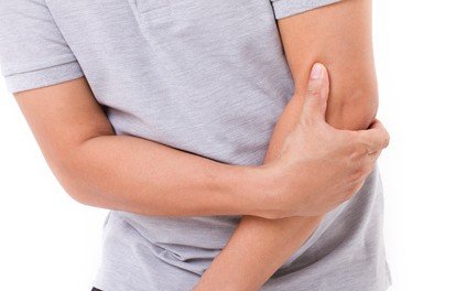 Man holding his forearm and elbow
